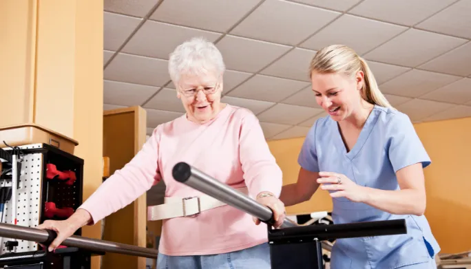 Physical therapist assessing a patient's movement and mobility